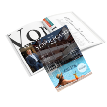 Magazine featuring a poolside setting with a person lounging and a drink.