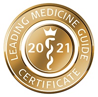 A round, gold medallion displays a caduceus beneath a crown, with "2021" at its center.